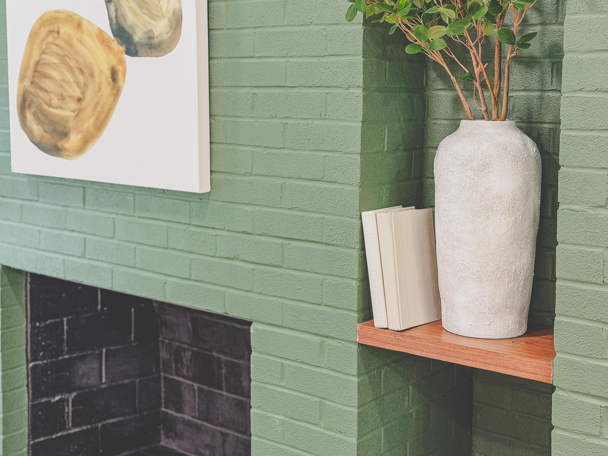 The same fireplace, close up on the brick and the vase