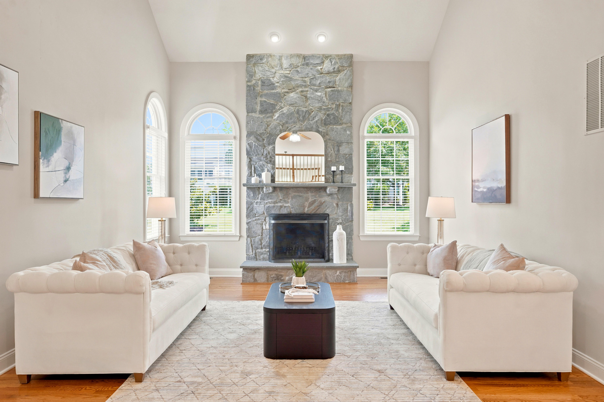 Great room with a stone fireplace and arched windows, Ashburn, Virginia